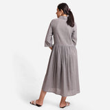 Back View of a Model wearing Grey Yarn Dyed Cotton Button-Down Dress