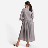 Back View of a Model wearing Grey Flat Collar Cotton Gathered Midi Dress
