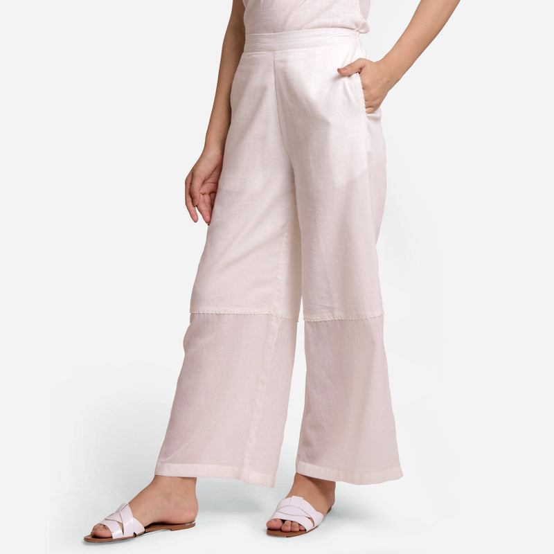 Left View of a Model wearing Off-White Hand Beaded Cotton Elasticated Wide Legged Pant