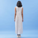 Back View of a Model wearing Hand Block Printed Minimal Pleated Maxi Dress