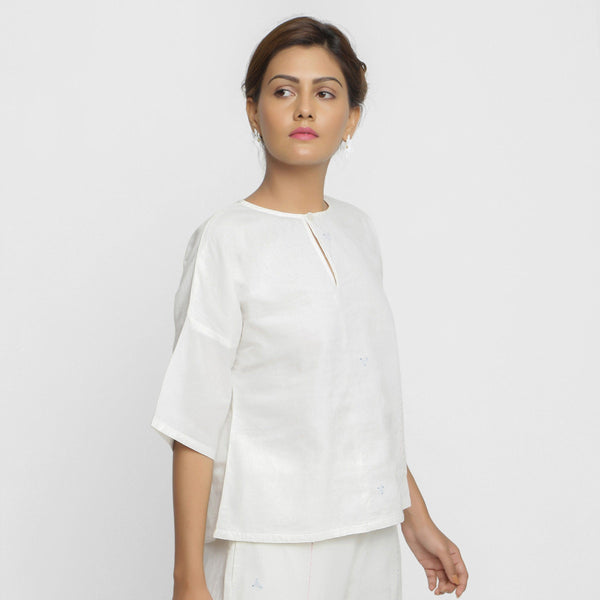 Right View of a Model wearing Hand Embroidered Organic Cotton Paneled Top