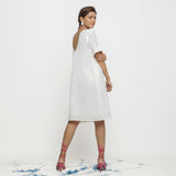 Back View of a Model wearing White Hand Embroidered Organic Cotton Knee Length Shift Dress