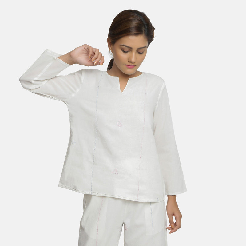 Front View of a Model wearing White Embroidered Organic Cotton Split Neck Top
