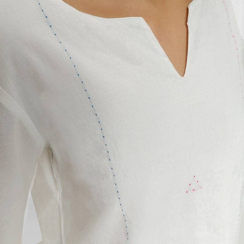 Front Detail of a Model wearing White Embroidered Organic Cotton Split Neck Top