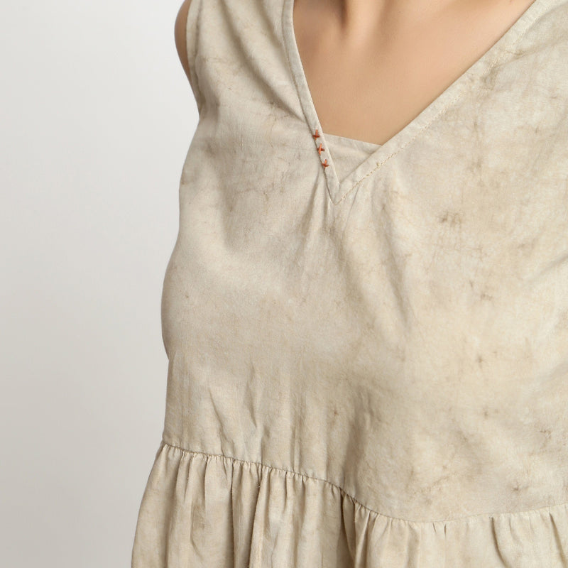 Front Detail of a Model wearing Beige Dabu Printed Sleeveless Gathered Top