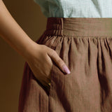 Right Detail of a Model wearing Handspun Brown Flared Shorts
