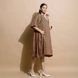 Right View of a Model wearing Handspun Brown Paneled Loose Fit Dress
