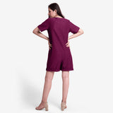 Back View of a Model wearing Handspun Cotton Mulberry Button-Down Romper