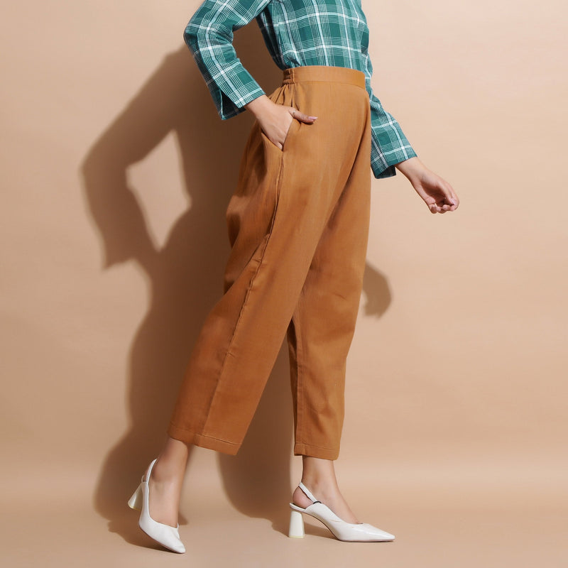 Right View of a Model wearing Handspun Cotton Muslin Mid-Rise Pant