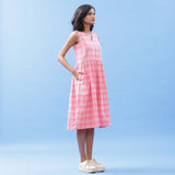 Right View of a Model wearing Pink Yarn Dyed Handspun Cotton V-Neck Yoked Midi Dress