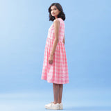 Left View of a Model wearing Pink Yarn Dyed Handspun Cotton V-Neck Yoked Midi Dress