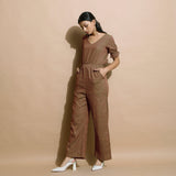Left View of a Model wearing Handspun Frilled Sleeve Straight Jumpsuit