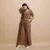 Left View of a Model wearing Handspun Frilled Sleeve Straight Jumpsuit