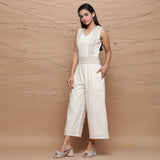 Left View of a Model wearing Handspun Ivory Jute Laced Jumpsuit