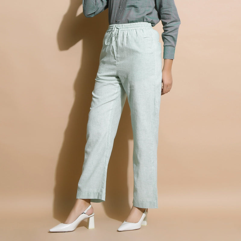 Left View of a Model wearing Light Green Checkered Cotton Muslin Elasticated Mid-Rise Pant
