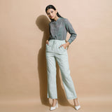 Front View of a Model wearing Light Green Checkered Cotton Muslin Elasticated Mid-Rise Pant
