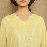 Front Detail of a Model wearing Handspun Light Yellow Gathered Dress