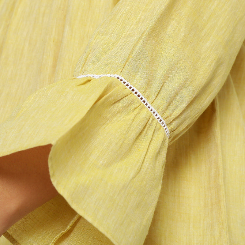 Close View of a Model wearing Handspun Light Yellow Poet Sleeve Top