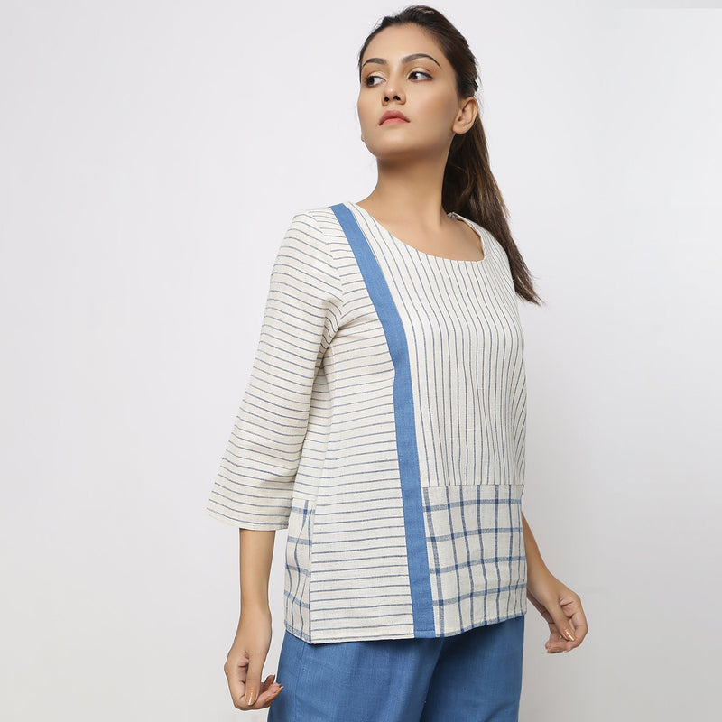 Right View of a Model wearing White and Blue Vegetable Dyed Handspun Cotton Paneled Top