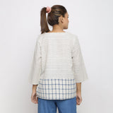 Back View of a Model wearing White and Blue Vegetable Dyed Handspun Cotton Paneled Top