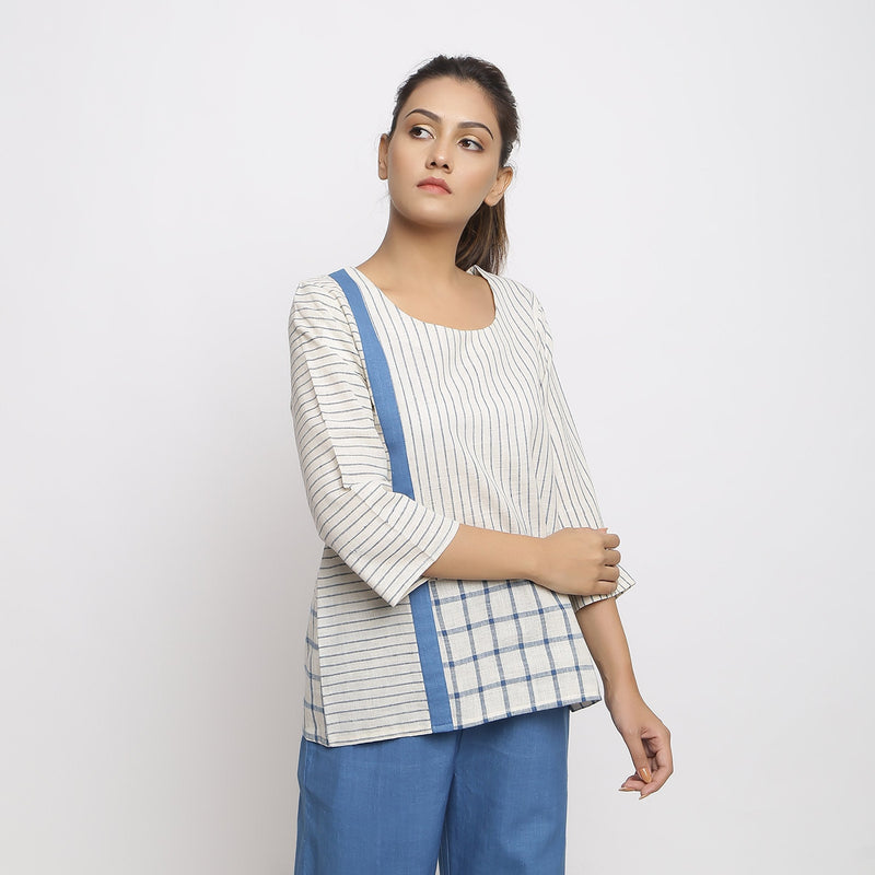 Right View of a Model wearing White and Blue Vegetable Dyed Handspun Cotton Paneled Top