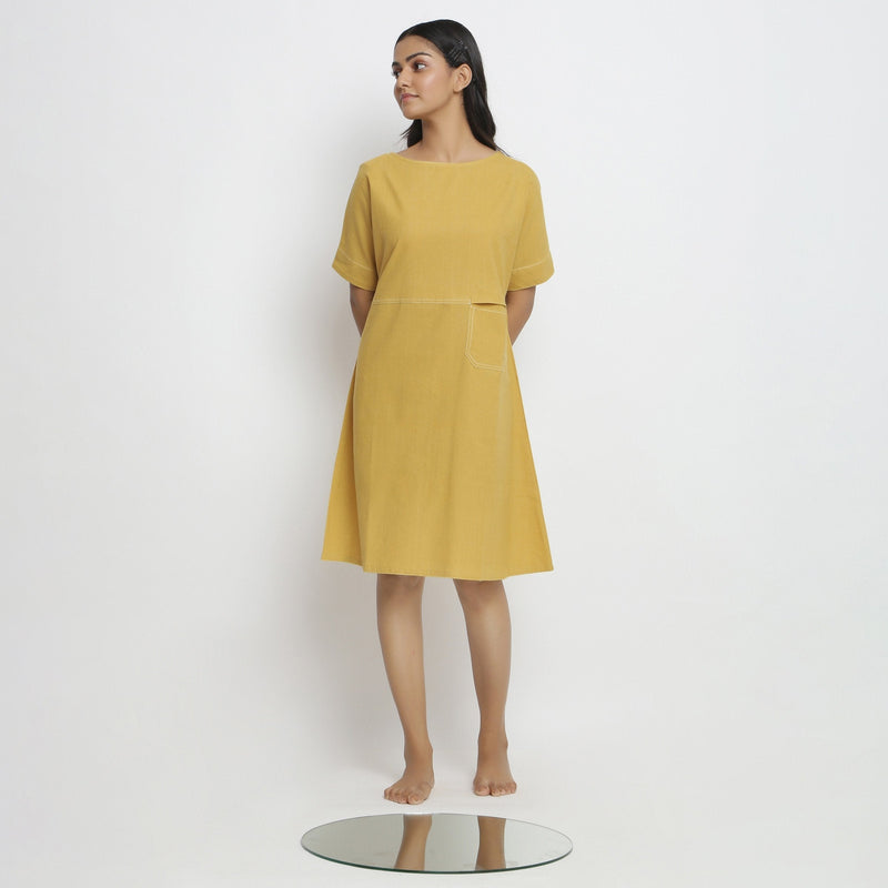 Front View of a Model wearing Lemon Yellow Vegetable Dyed Handspun Cotton Knee Length Yoked Dress