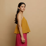 Right View of a Model wearing Handwoven Cotton Flared Godet Top