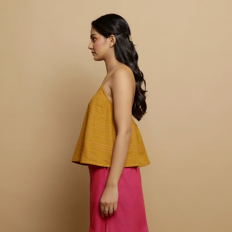 Left View of a Model wearing Handwoven Cotton Flared Godet Top