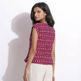 Back View of a Model wearing Berry Wine Handwoven Cotton Ikat Round Neck Cap Sleeve Top