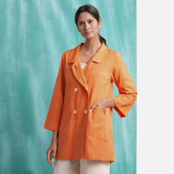 Front View of a Model wearing Handwoven Orange Welt Pocket Coat