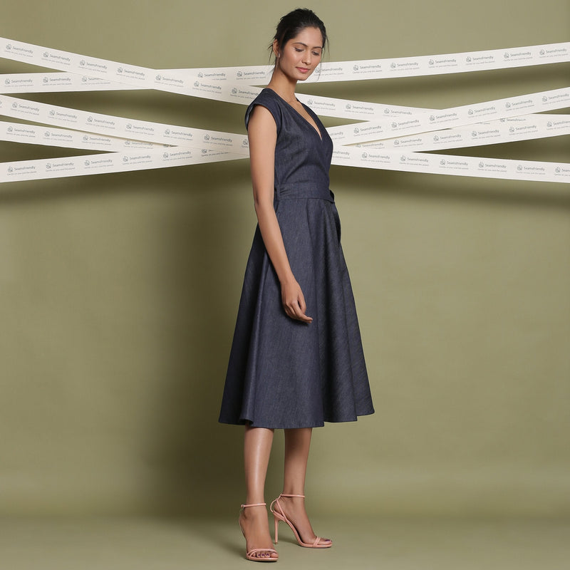 Right View of a Model wearing Indigo Cotton Denim V-Neck Fit and Flare Midi Dress