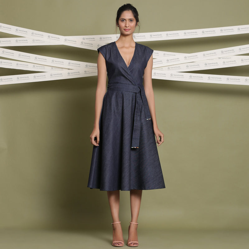Front View of a Model wearing Indigo Cotton Denim V-Neck Fit and Flare Midi Dress
