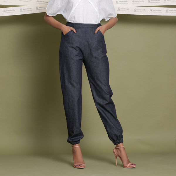 Front View of a Model wearing Indigo Cotton Denim Elasticated Mid-Rise Jogger Pant