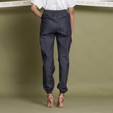Back View of a Model wearing Indigo Cotton Denim Elasticated Mid-Rise Jogger Pant