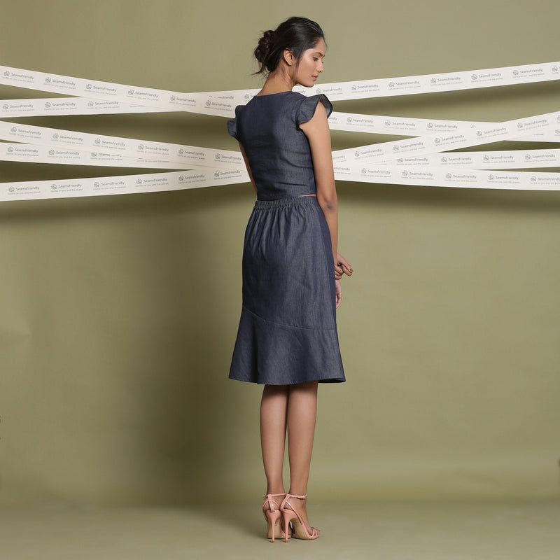 Back View of a Model wearing Indigo Cotton Denim Paneled A-Line Skirt