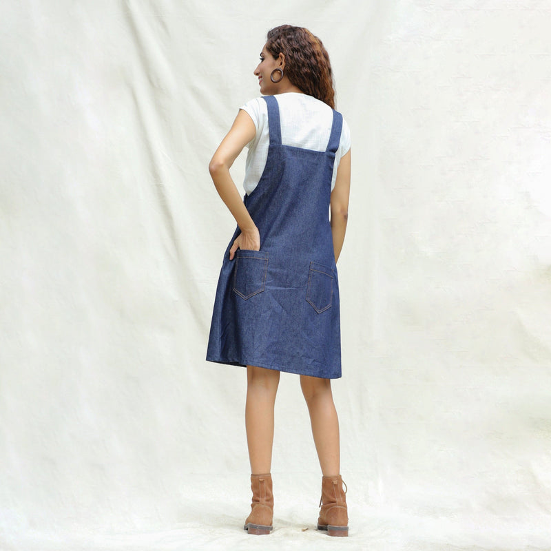 Back View of a Model wearing Indigo Cotton Denim Pinafore Knee Length Dress