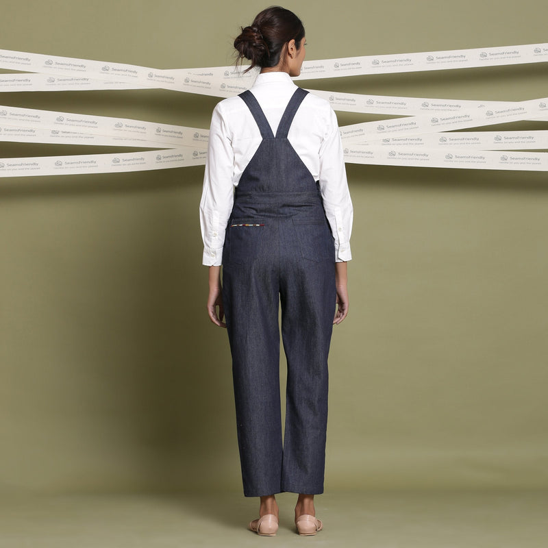 Back View of a Model wearing Indigo 100% Cotton Denim Strap Sleeve Dungaree