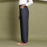 Left View of a Model wearing Indigo Cotton Denim Wide Legged Jeans