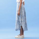 Left View of a Model wearing Indigo Dabu Printed Cotton Elasticated A-Line Maxi Skirt