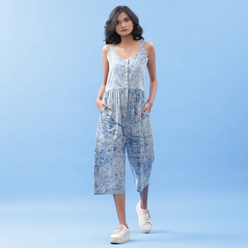 Front View of a Model wearing Indigo Dabu Printed Button-Down Jumpsuit