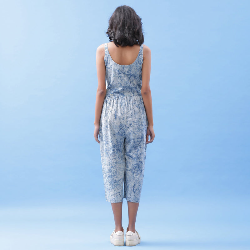 Back View of a Model wearing Indigo Dabu Printed Button-Down Jumpsuit
