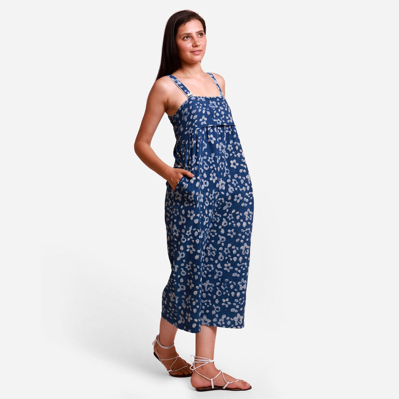 Right View of a Model wearing Indigo Flared Midi Floral Jumpsuit