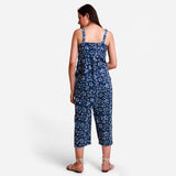 Back View of a Model wearing Indigo Flared Midi Floral Jumpsuit