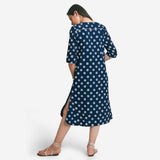 Back View of a Model wearing Indigo Polka Dot Plunge Neck Dress