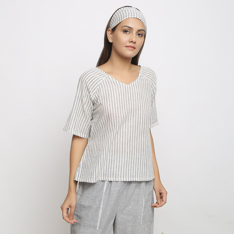 Right View of a Model wearing Ivory and Charcoal Striped A-Line Top