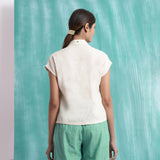 Back View of a Model wearing Ivory Handspun Relaxed Mirror Work Shirt