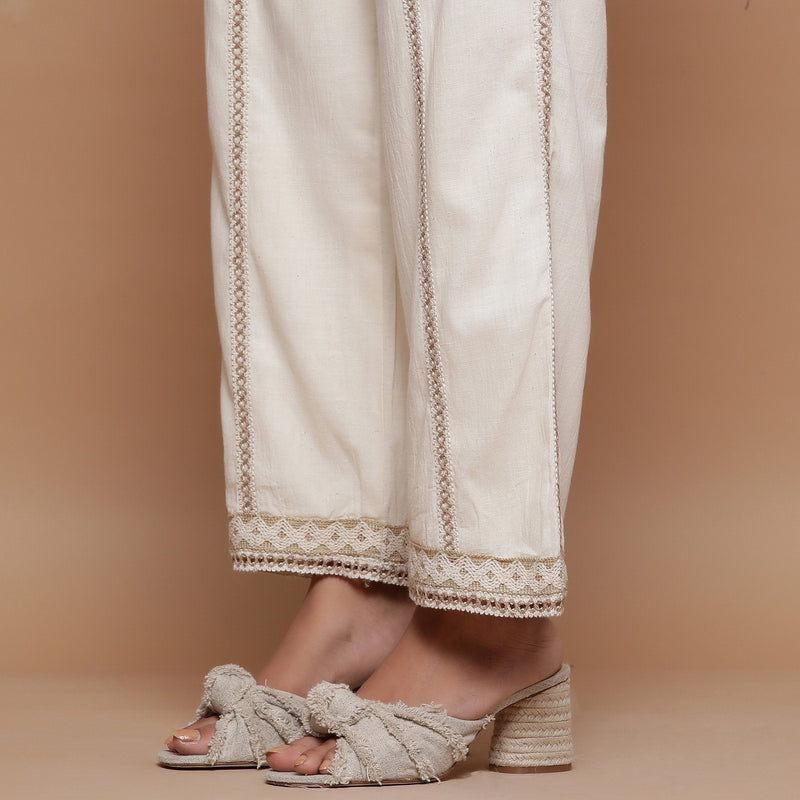 Close View of a Model wearing Ecru Jute Laced Cotton Muslin Mid-Rise Elasticated Pant