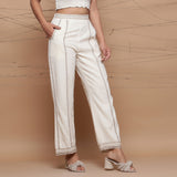 Right View of a Model wearing Ecru Jute Laced Cotton Muslin Mid-Rise Elasticated Pant