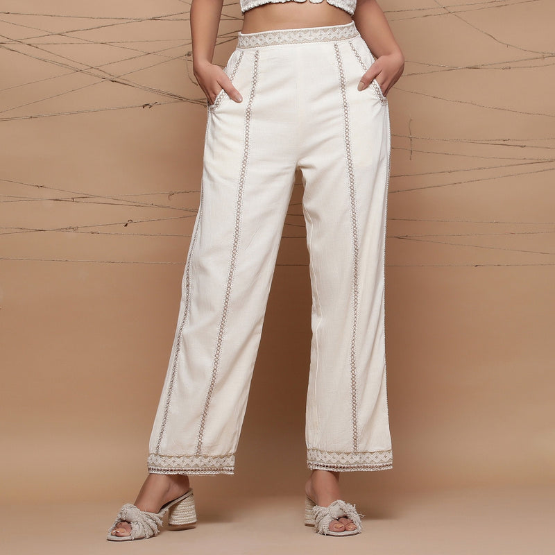 Front View of a Model wearing Ecru Jute Laced Cotton Muslin Mid-Rise Elasticated Pant