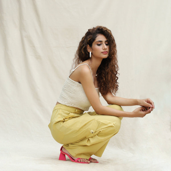 Right View of a Model wearing Khakhi Green Cotton Flax High-Rise Cargo Pant
